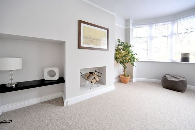 A Living Room With A Fireplace And A Picture On The Wall — Affordable Carpets Woolgoolga In Woolgoolga, NSW