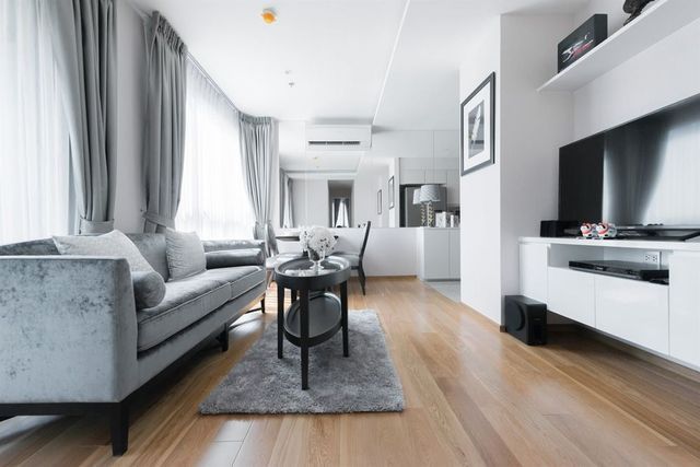 A Living Room With A Couch, Table, And Television — Affordable Carpets Woolgoolga In Woolgoolga, NSW