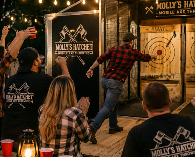 A man throws an axe at a target at a 