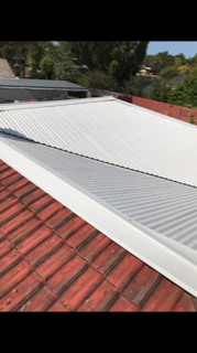 Roof Repair Using Hand Driller — Roofing in Townsville, QLD