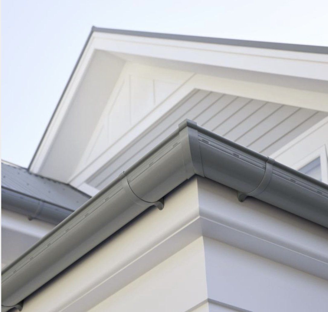 Roof Gutter Attached To Wall— Roofing in Townsville, QLD