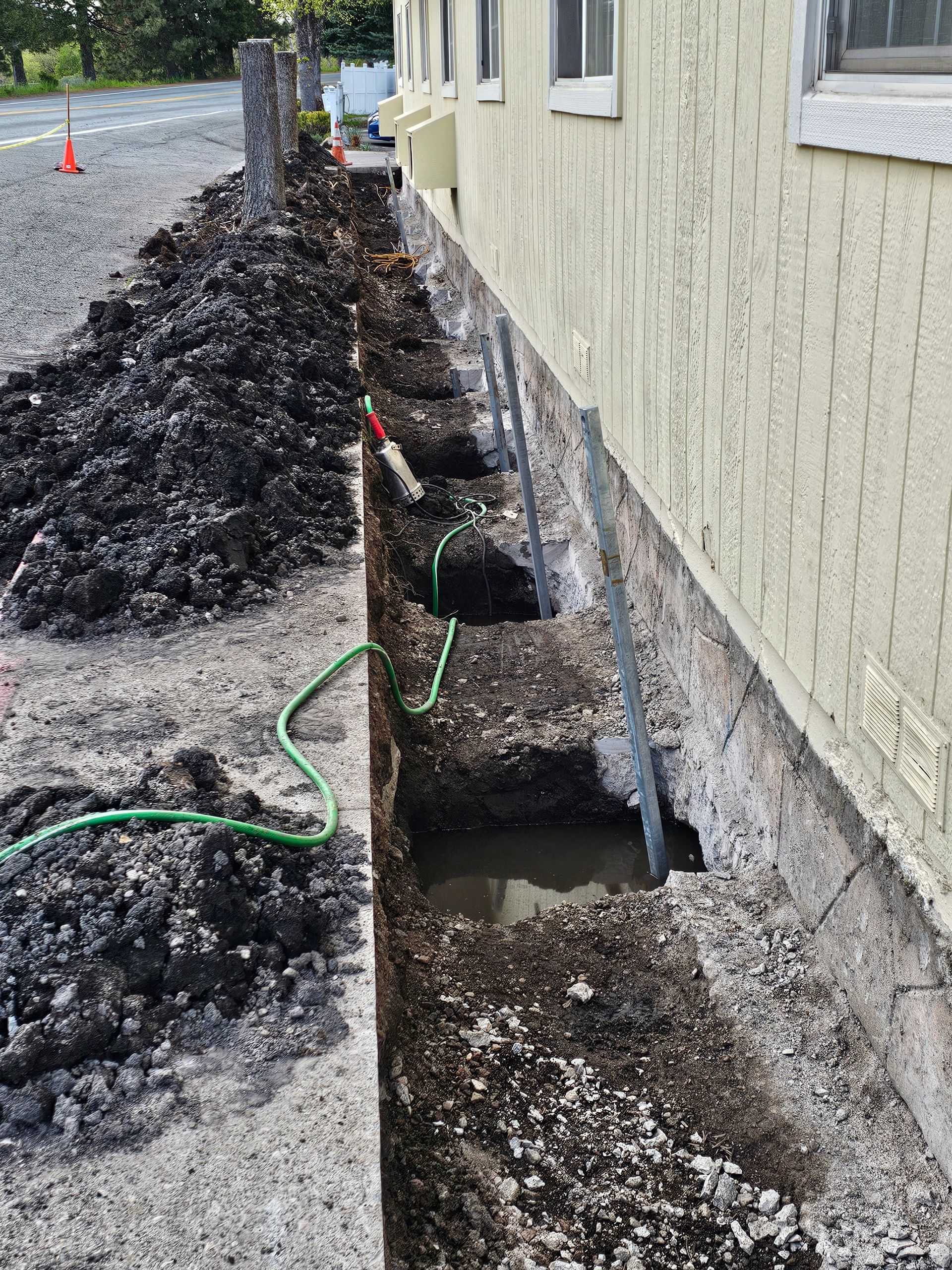 Helical foundation supports are being installed on a house in Medford, Oregon