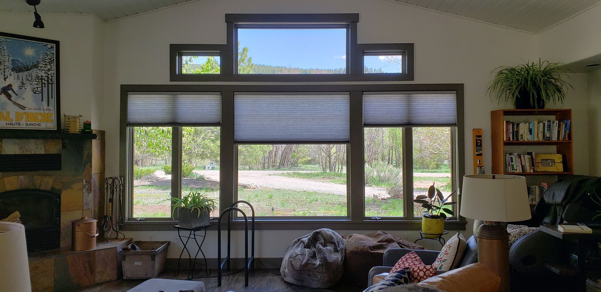 a living room with a cellular shades on a living room window