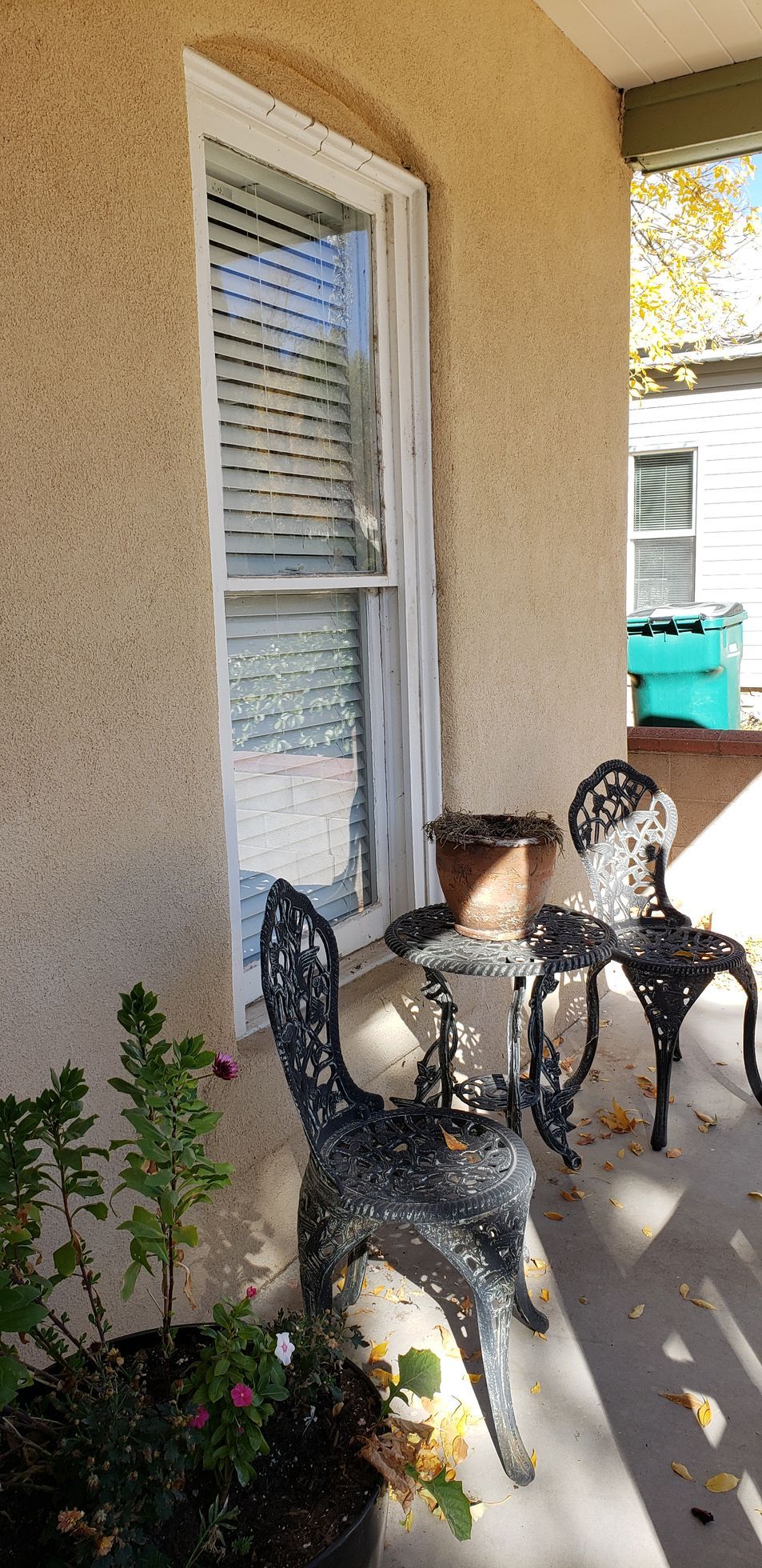 white framed window with white wooden blinds