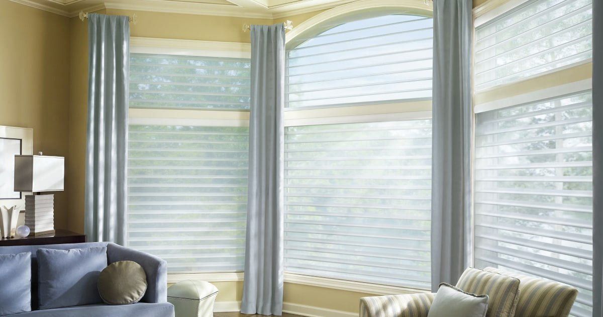 Living room with blinds installed by Affordable blind pro