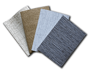 a bunch of different colored textures of fabrics are stacked on top of each other on a white background .