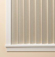 a close up of a window with vertical G-85 Dura VUE blinds and a white trim .