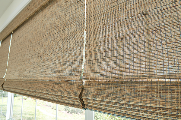 A window with a wicker blind on it