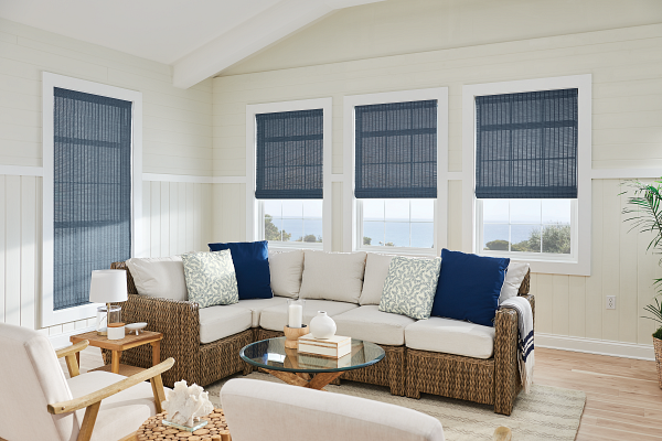 A living room with a couch , chairs , and a table.
