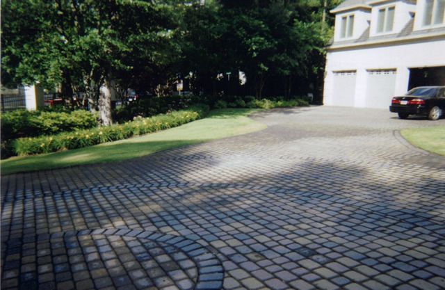 A car is parked in the driveway of a house