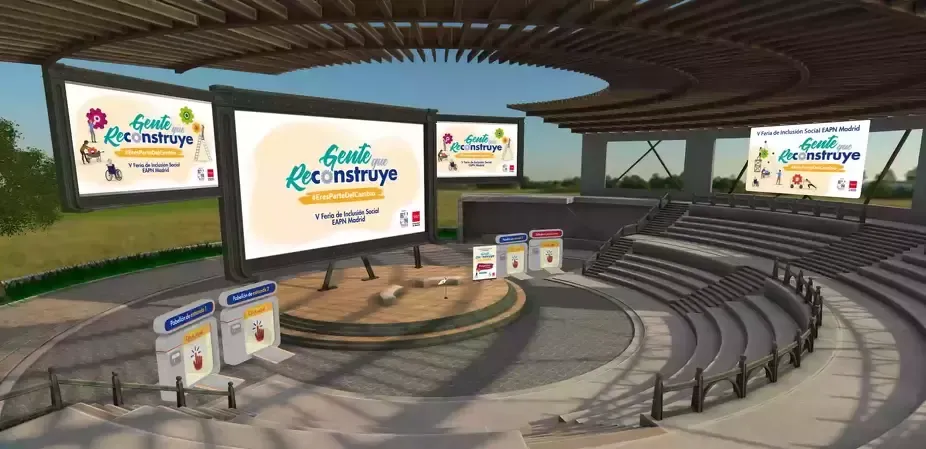 An outdoor amphitheater stage with screens showing