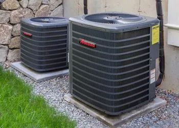 A group of air conditioners and a thermostat on a white background.