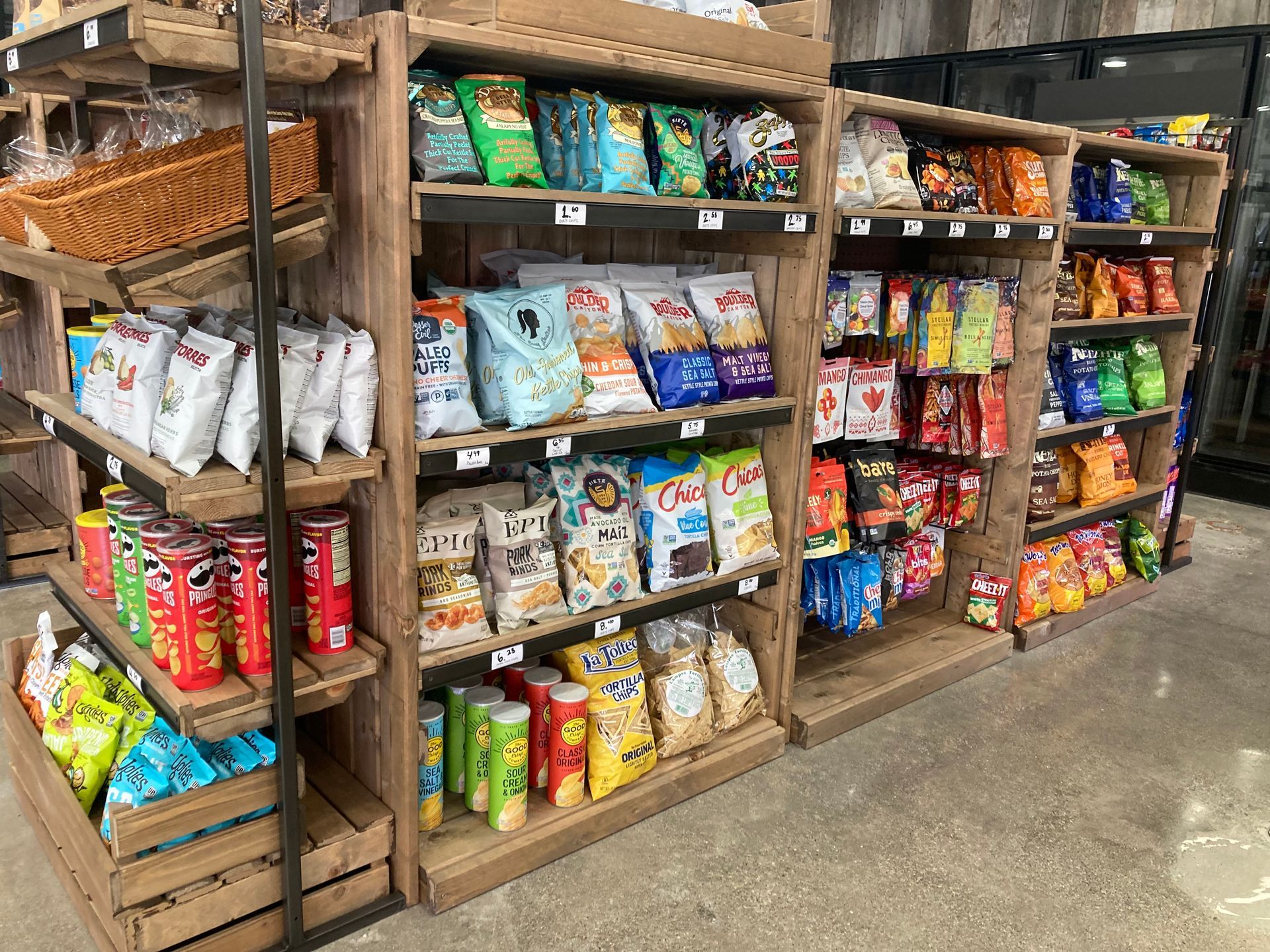 Store interior showcasing shelves stocked with assorted chips.