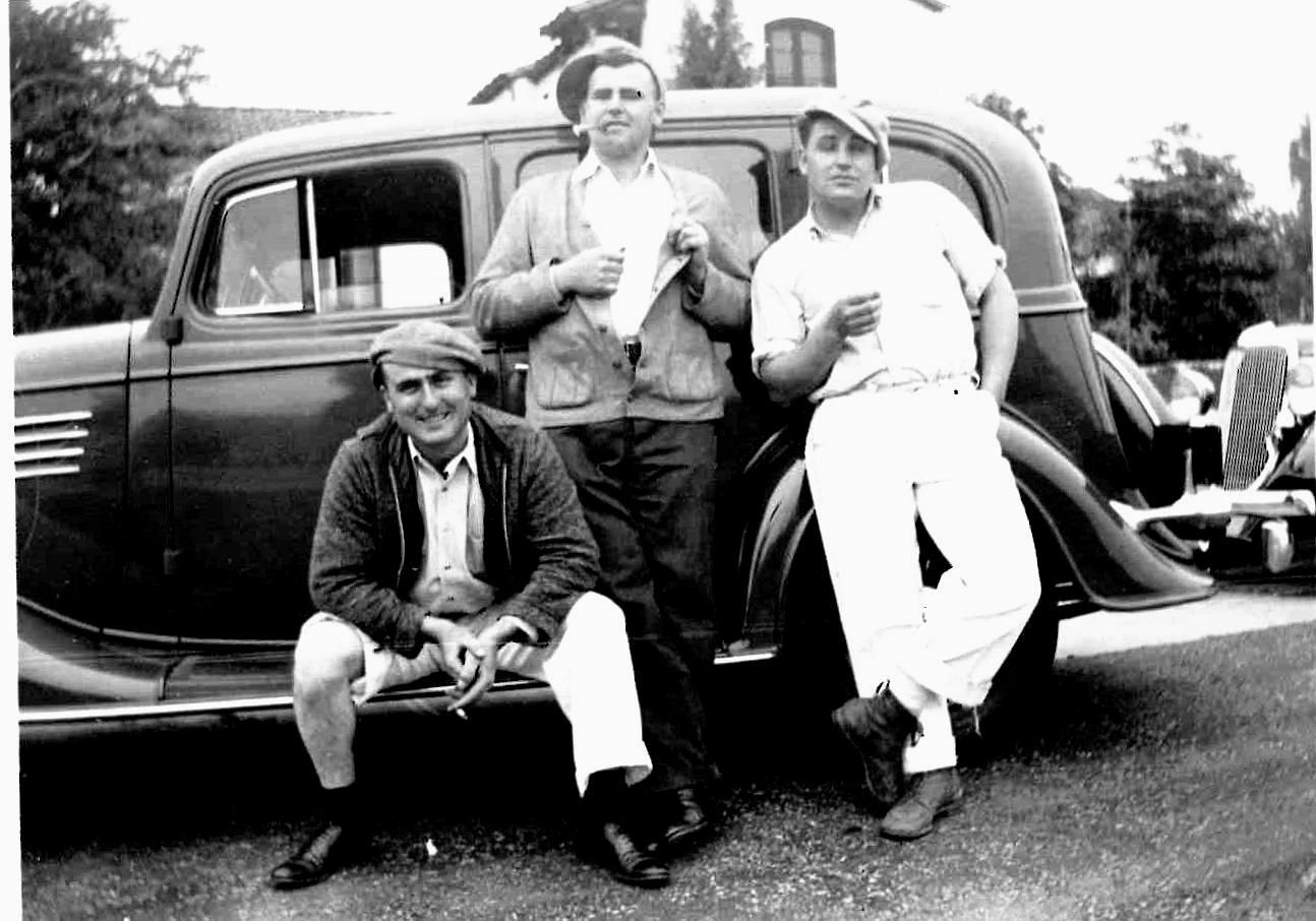 Grandfather, uncle, and third man posing by an old car, Easter 1933.