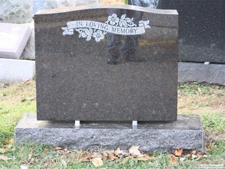 a gravestone in a cemetery that says loving memory