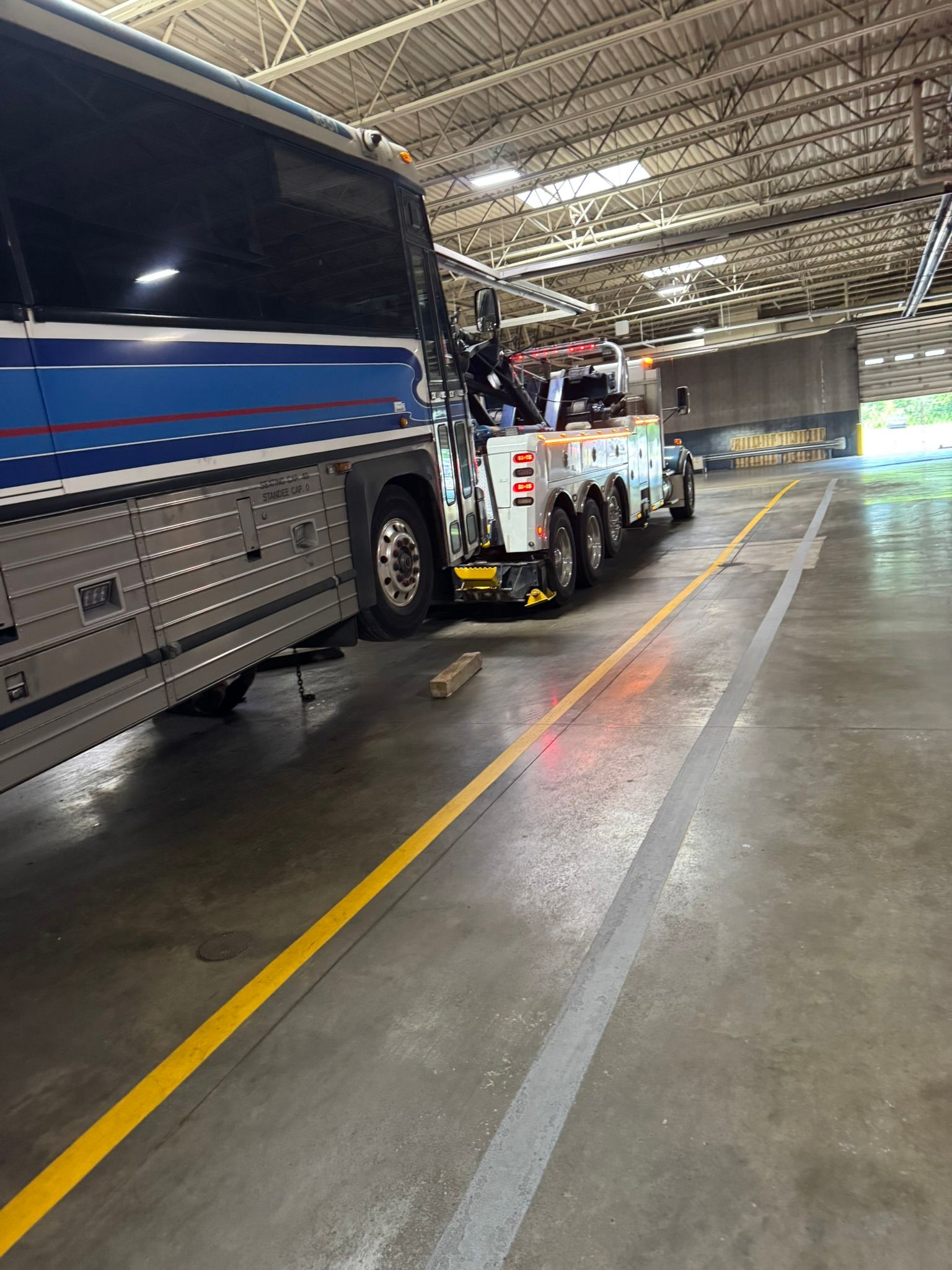 Rotator Towing a Bus