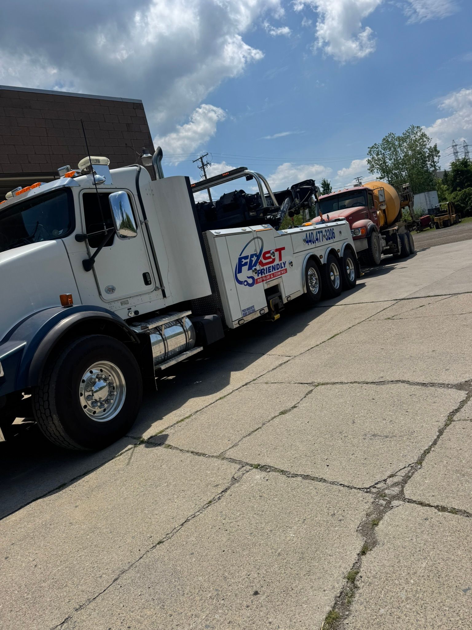 Rotator Towing a Cement Mixer