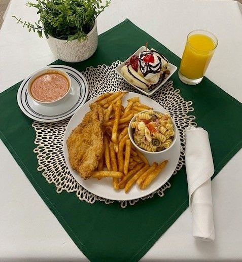 A table with plates of food and drinks on it