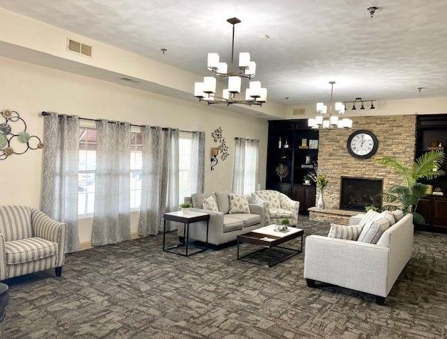 A living room filled with furniture and a fireplace.