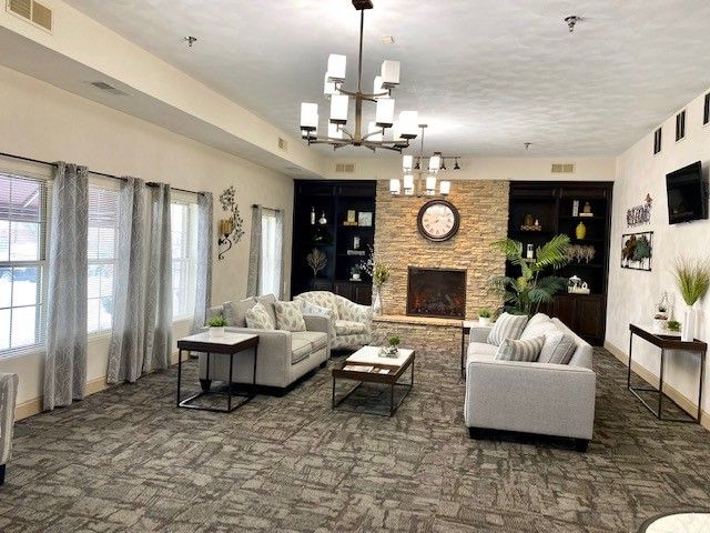 A living room filled with furniture and a fireplace.