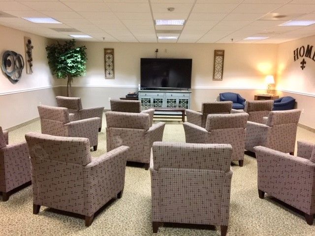 A room filled with chairs and a flat screen tv