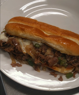 A close up of a sandwich on a white plate