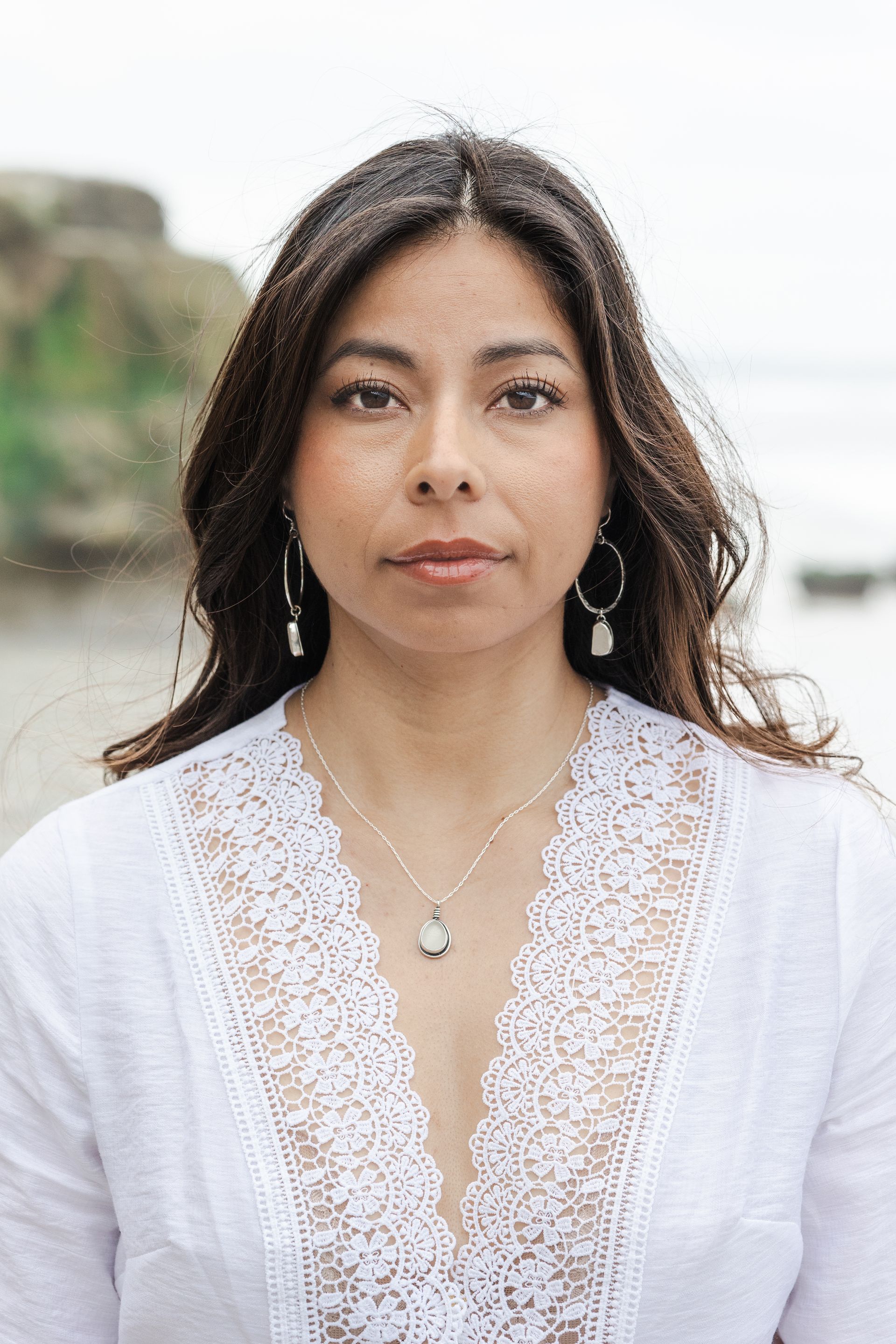 Woman wearing jewelry looking out into the distance