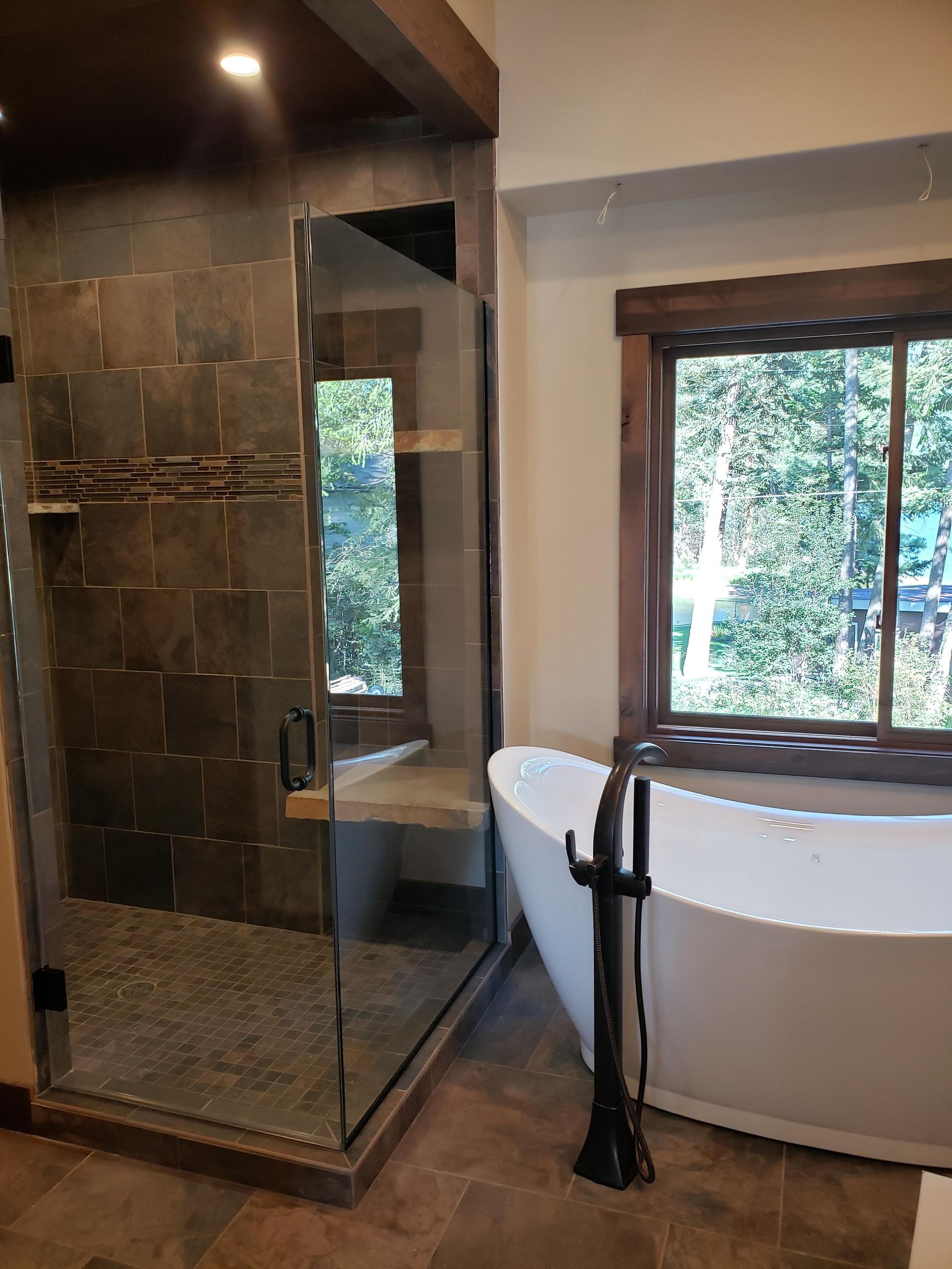 An aerial view of a house under construction in the middle of a dirt field.