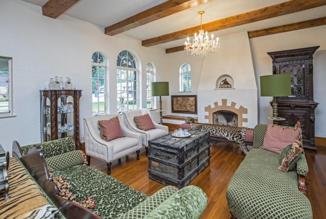 A living room filled with furniture and a fireplace.