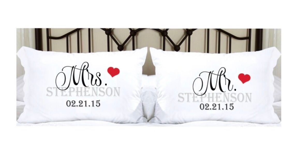 Two white pillows: “Mrs.” with a red heart, “Mr.” with a red heart, and the last name “Stephenson,” and the date “02.21.15.”