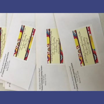 A bunch of envelopes are stacked on top of each other