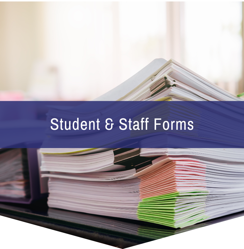 A stack of student and staff forms on a table