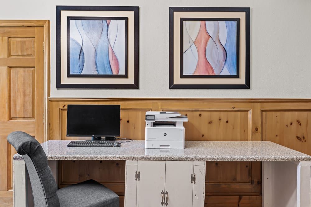 Business center with a desk, a computer, and a printer at Marquis at Silverton in Cary, NC.