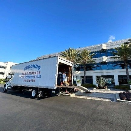 Moving truck unloading at office building. Moving truck unloading at office building.