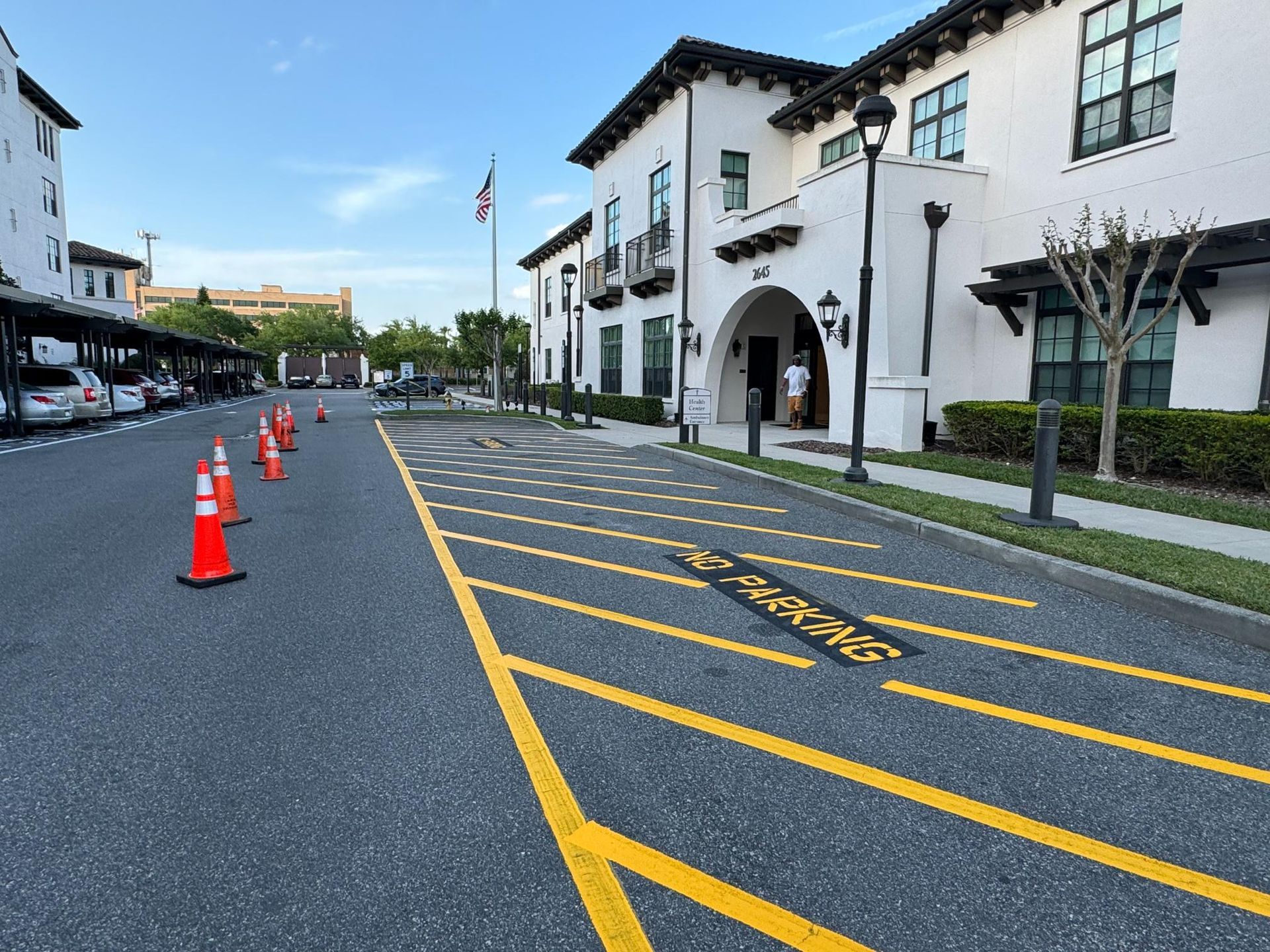 A parking lot with yellow lines on it