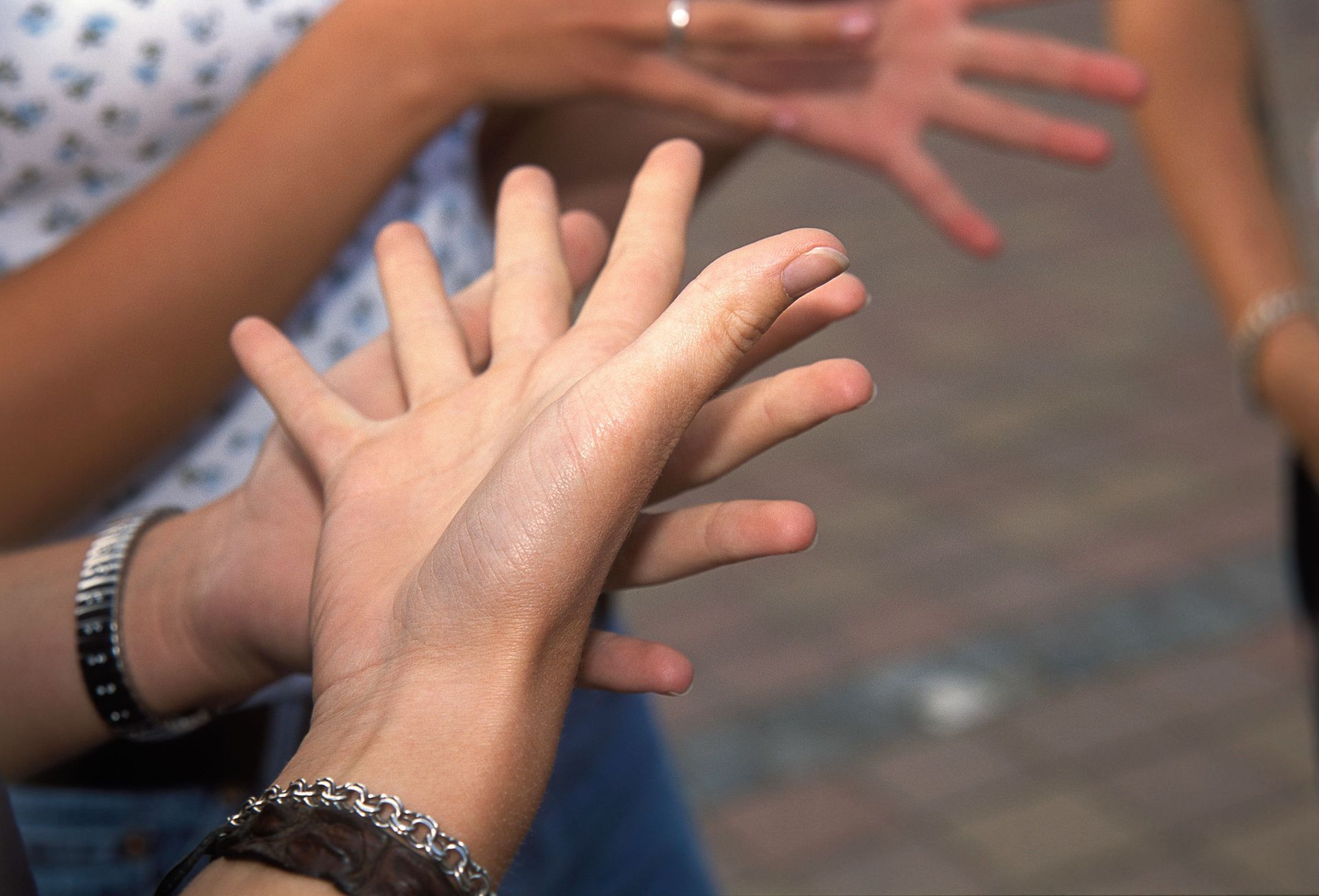 A group of people are signingBSL together.