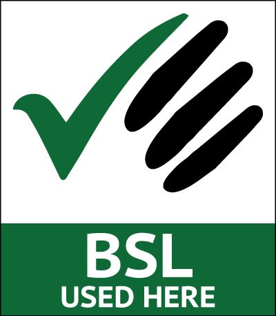 A green and white sign that says bsl used here