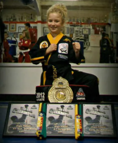 Girl Won With Certificate And Medals — Amarillo, TX — Amarillo Karate & Fitness