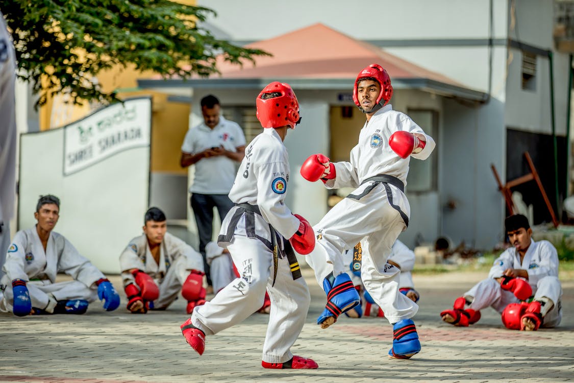 taekwondo athletes sparring with protective gears