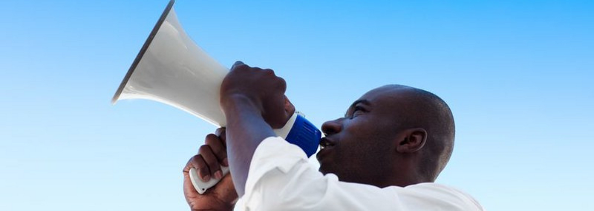 Picture of  a person shouting into a megaphone.
