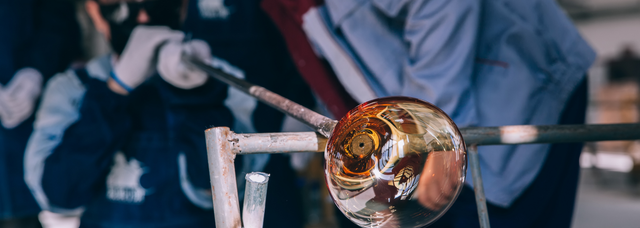 Picture of a glassblower blowing glass Picture of a glassblower blowing glass