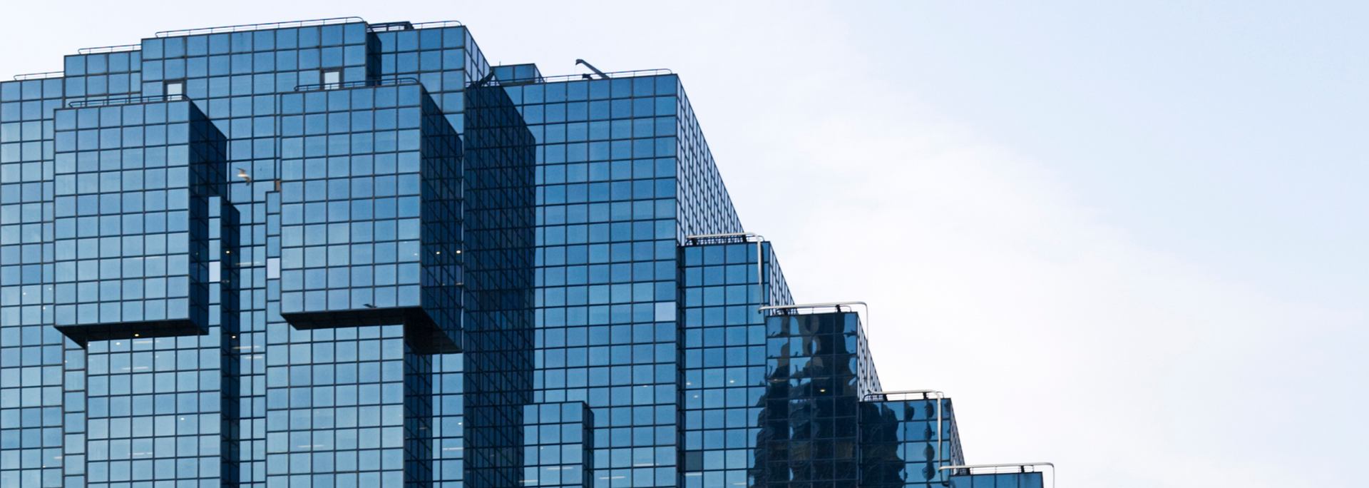 Picture of a large glass building.