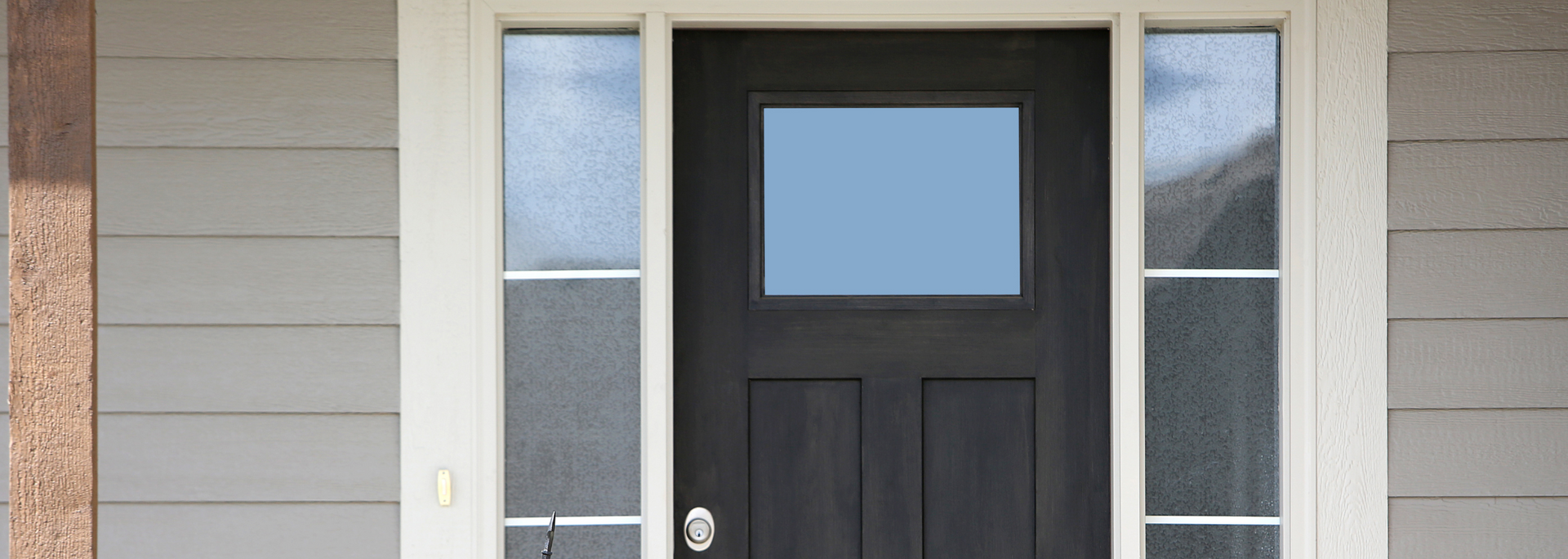 Picture of a wooden door with a glass window.