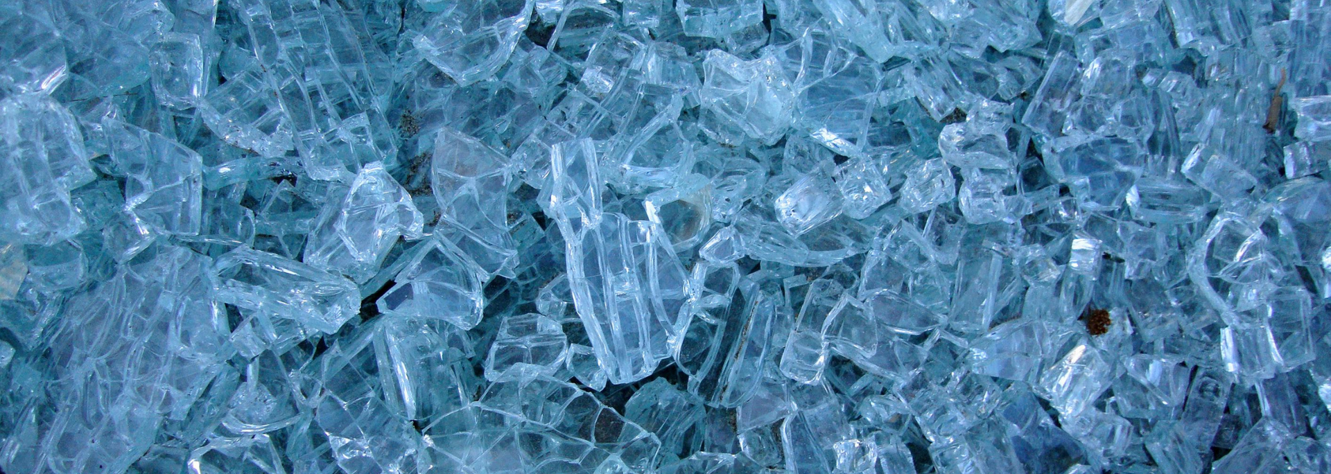 Picture of broken toughened glass in smooth shards.