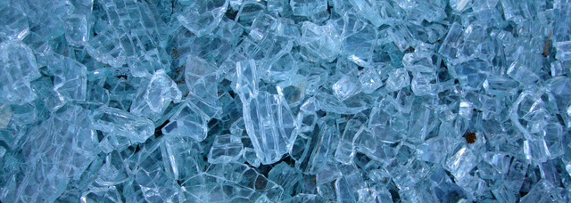 Picture of broken toughened glass in smooth shards. Picture of broken toughened glass in smooth shards.