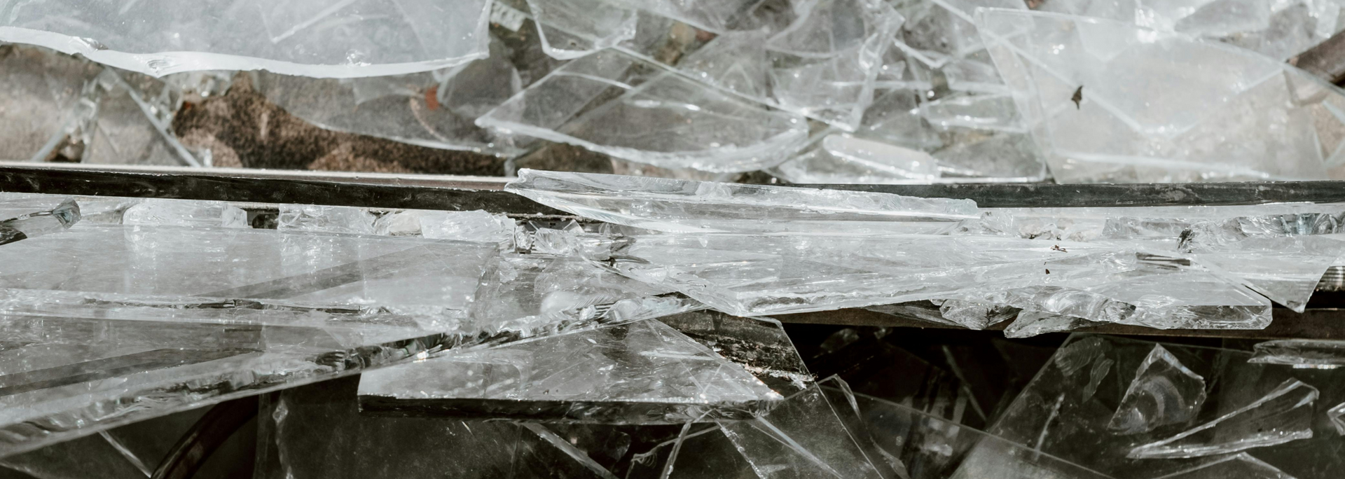 Picture of shards of glass on the floor.