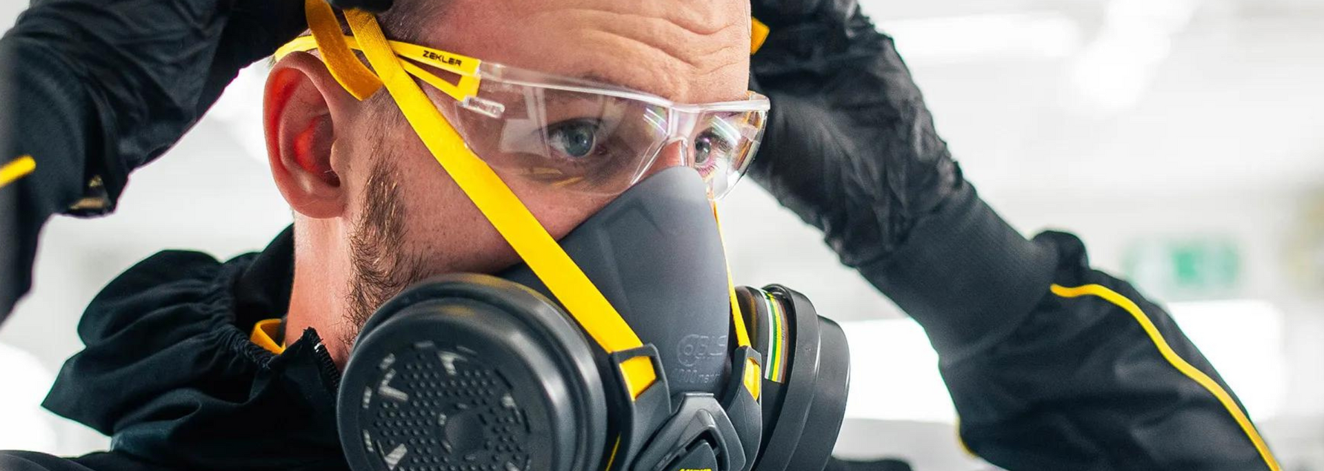 Picture of someone kitted out with protective gloves, goggles and a gas mask. Picture of someone kitted out with protective gloves, goggles and a gas mask.