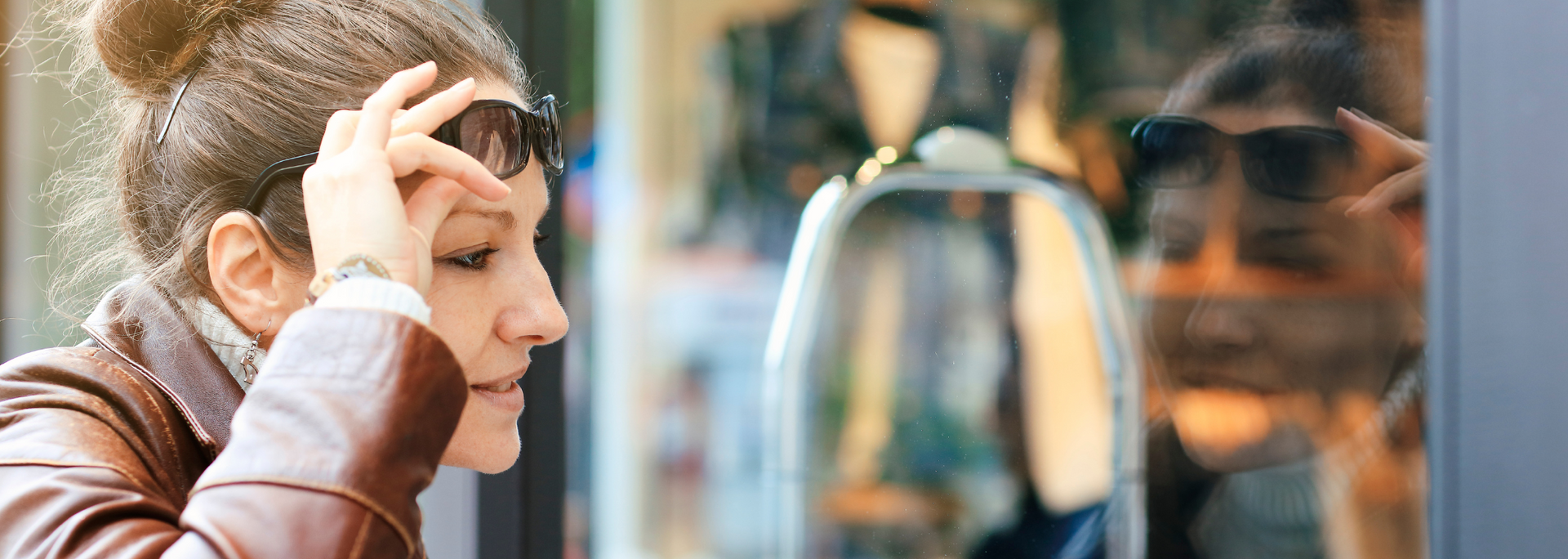 Picture of someone looking into a shop window.