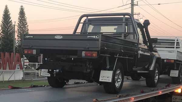 A Truck Is Sitting on Top of A Flatbed Tow Truck — Welshpool, WA — PTE Group Pty Ltd