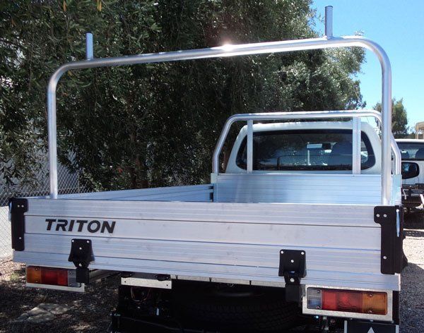 The Back of A Triton Truck with A Ladder Rack Attached to It — Welshpool, WA — PTE Group Pty Ltd
